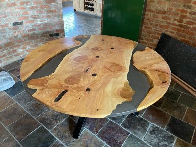 Custom epoxy river table in Newtownabbey, Northern Ireland dining space