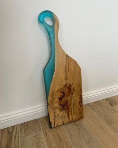 Resin table detail in Northern Ireland showing epoxy and wood grain